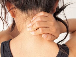 Lady with neck pain in need of whiplash treatment