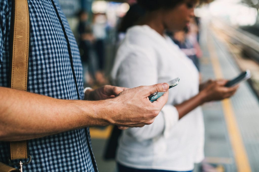 Man texting with neck and back pain