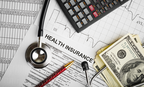The high cost of back pain from car accident treatment illustration with money, calculator, stethoscope and charts
